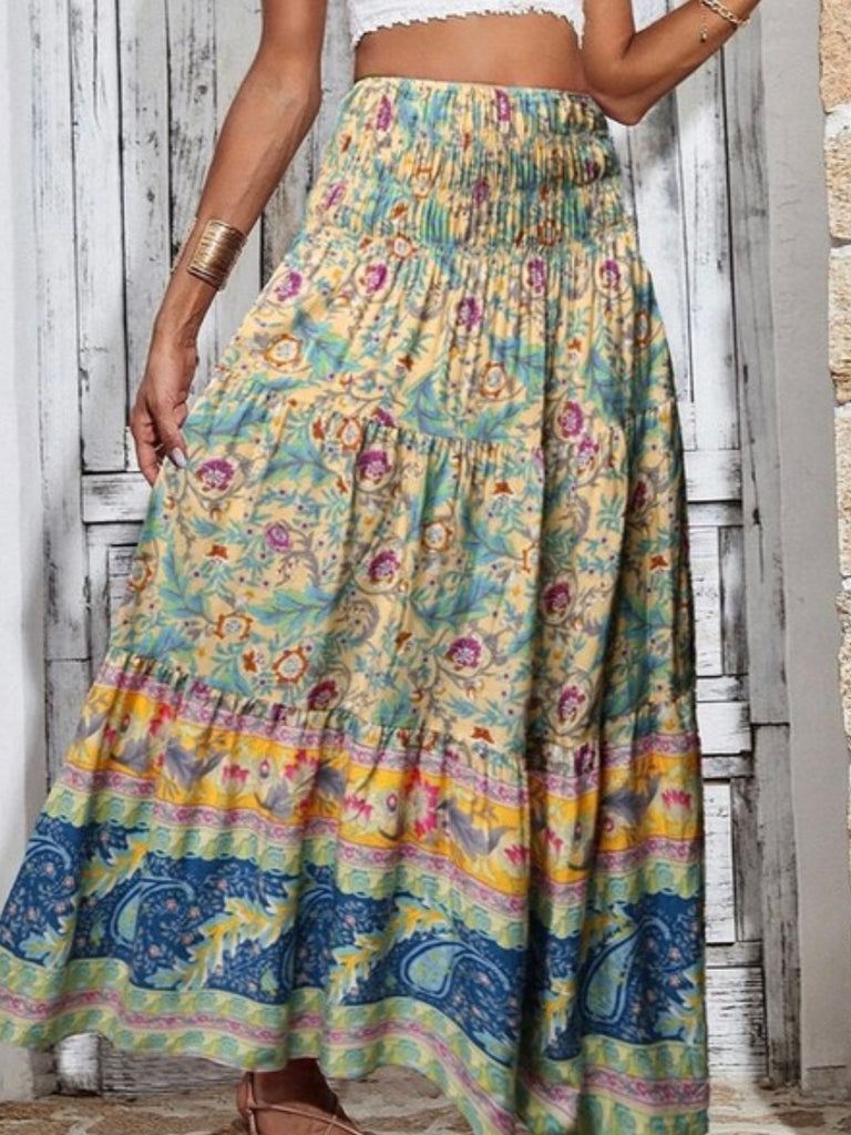 Crafted from 100% viscose, Maxi Skirt Featuring a smocked waistband vibrant blend of yellow, blue, green, and magenta