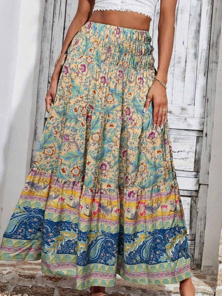 Crafted from 100% viscose, Maxi Skirt Featuring a smocked waistband vibrant blend of yellow, blue, green, and magenta