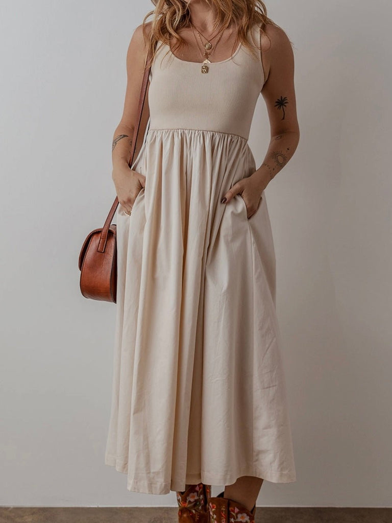 Beige scoop neck summer dress styled with boots for effortless boho chic fashio