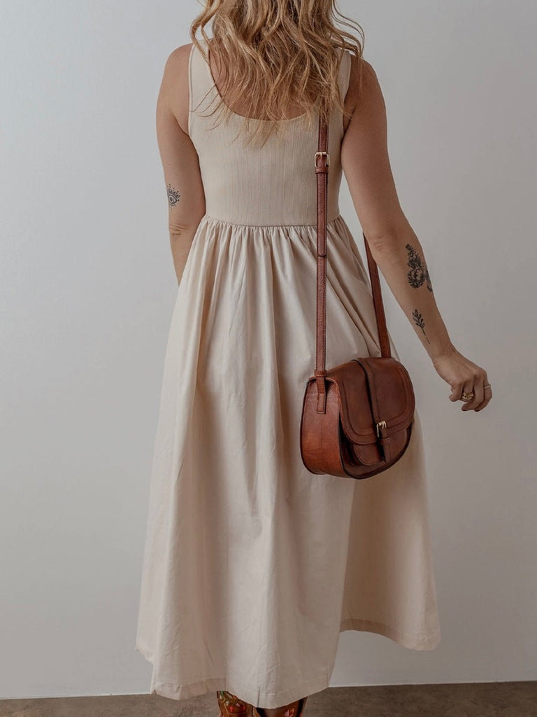 Lightweight sleeveless dress with ribbed bodice and flowing pleated skirt for summer