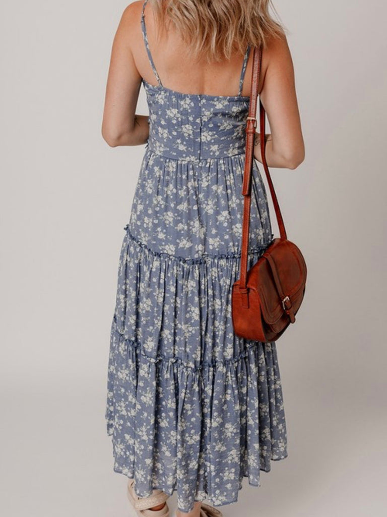 Back view of flowy blue floral maxi dress with adjustable straps