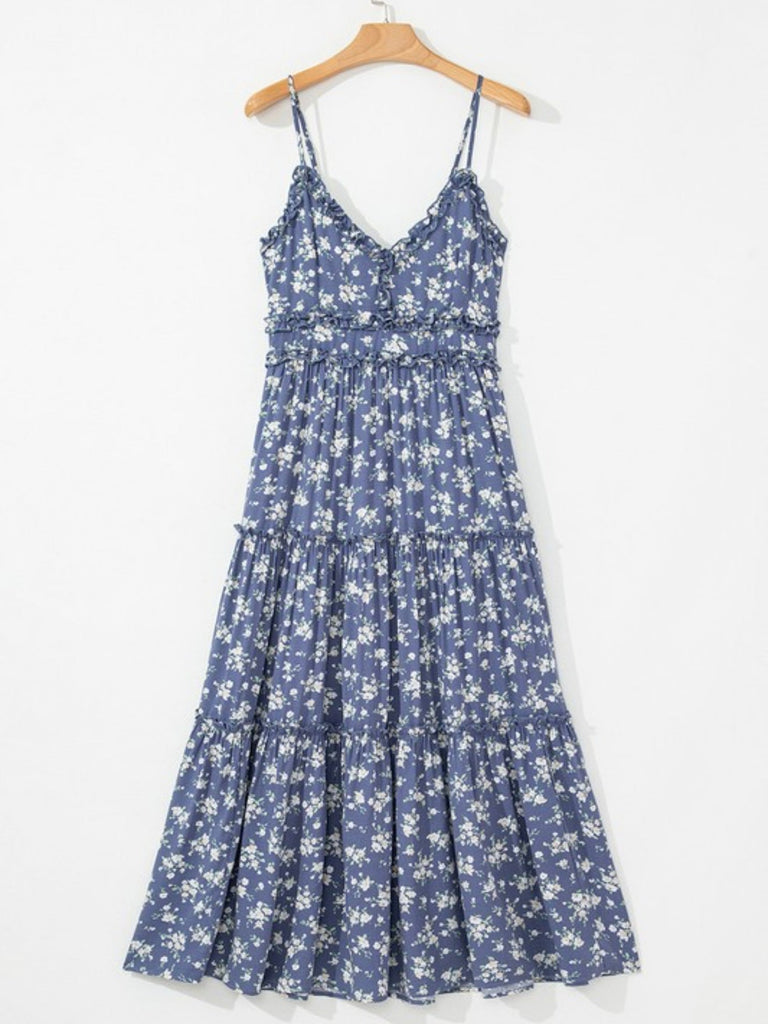 Blue floral spaghetti strap maxi dress hanging on wooden hanger, front view
