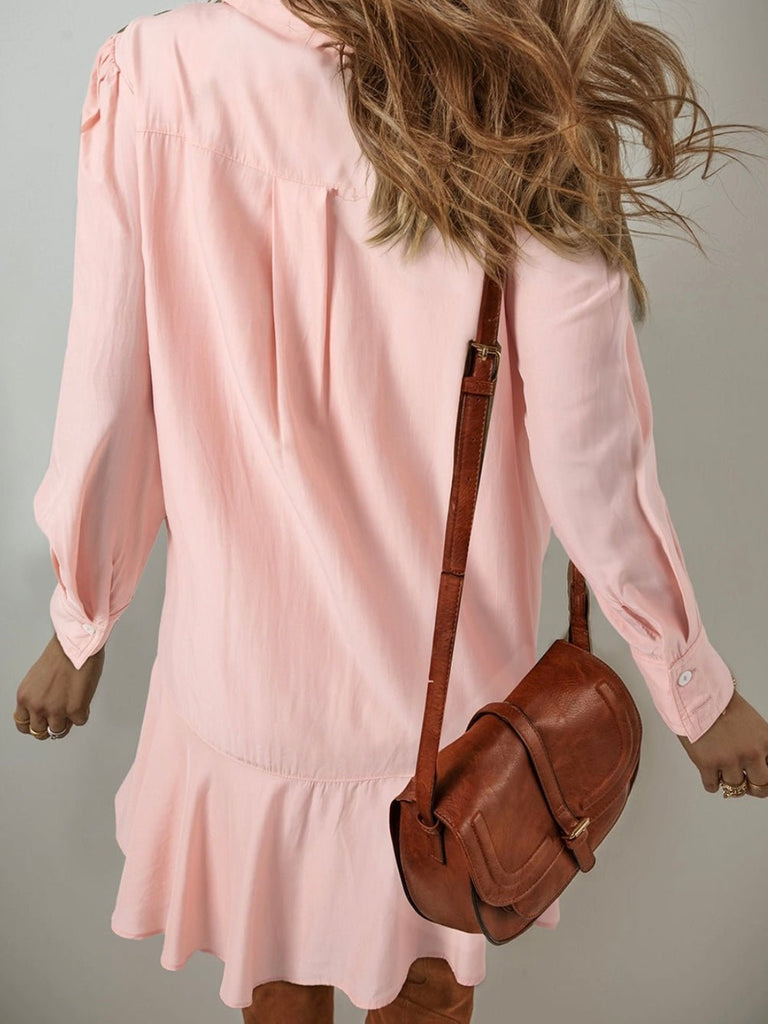 Back view of flowy pink shirt dress showing loose fit and movement