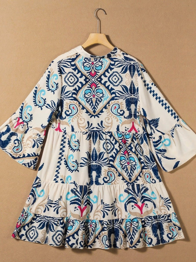 Trendy bracelet sleeves and buttoned design Tunic Dress , Featuring a vibrant blue and magenta tribal print.