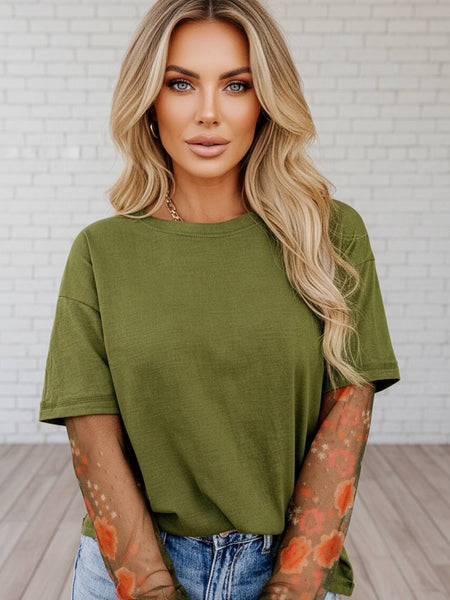 Women's double green mesh sleeve tee with floral mesh underlay styled with a jeans – trendy boutique top from Oak & Pearl Clothing Co.
