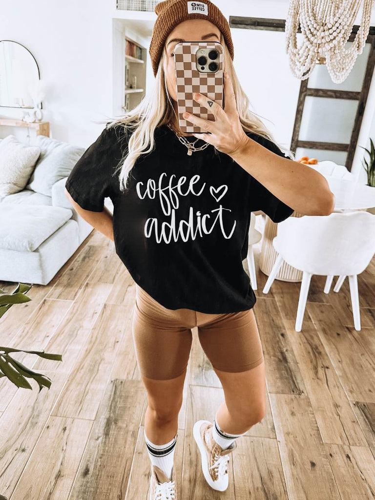 Black and White Tee has a true-to-size fit and a cool coffee addict graphic on the front.