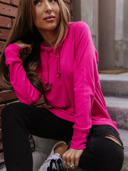Pink side slit hoodie triple stretch construction with draw strings.