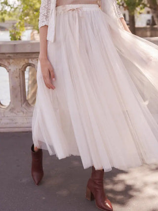 Tulle Ecru Tutu Skirt featuring a thin elastic waistband and flared cut with ruffle-effect details.