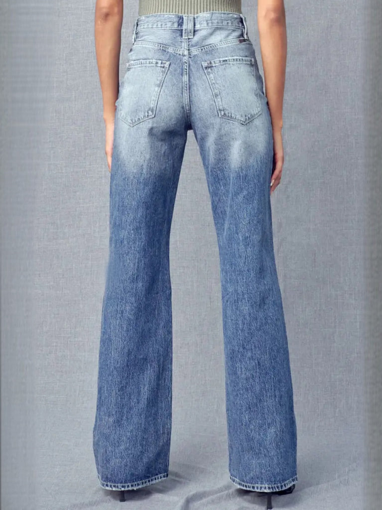 Minor Fading and Whiskering 5 piece button front Flare Jeans with distressed detail at knee.