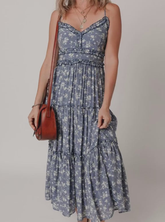 Model showing flow and movement of the blue floral maxi dress