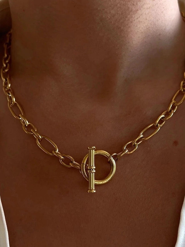 Gold toggle necklace made with stainless steel in a 18k gold plated finish with a 15.75” chunky oval link chain.