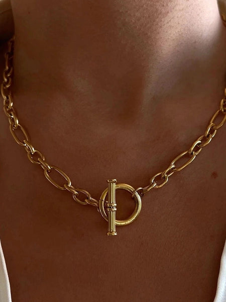 Gold toggle necklace made with stainless steel in a 18k gold plated finish with a 15.75” chunky oval link chain.