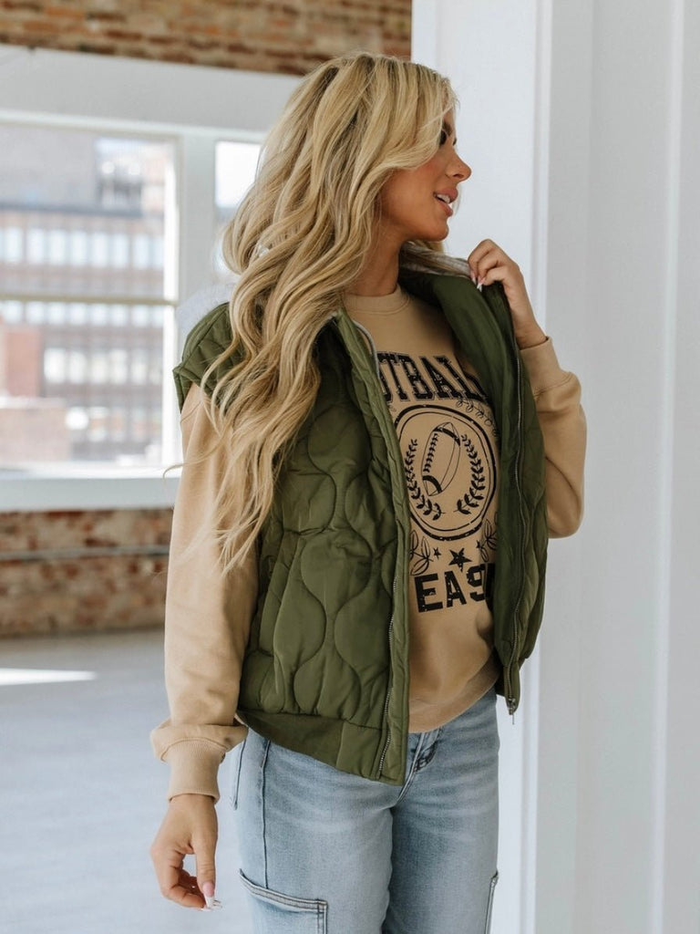 Olive Green ,Quilted Hooded Vest with attached grey hood for added warmth and zip style front closure.