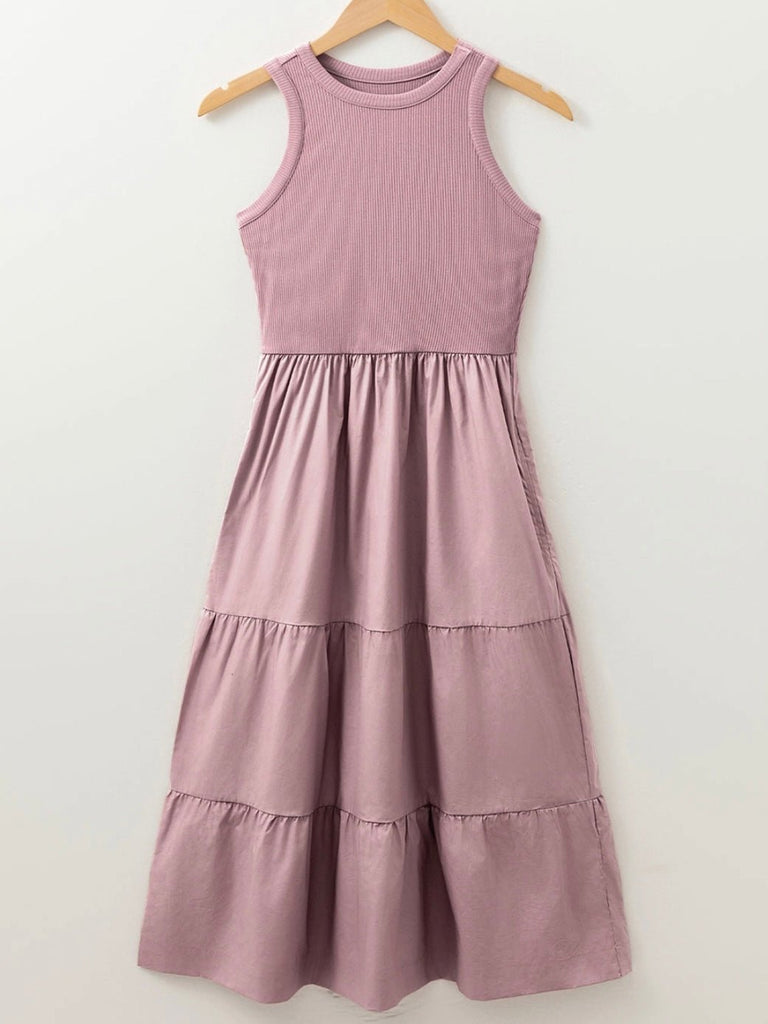 Flowy pink midi dress with casual style hanging on a hanger