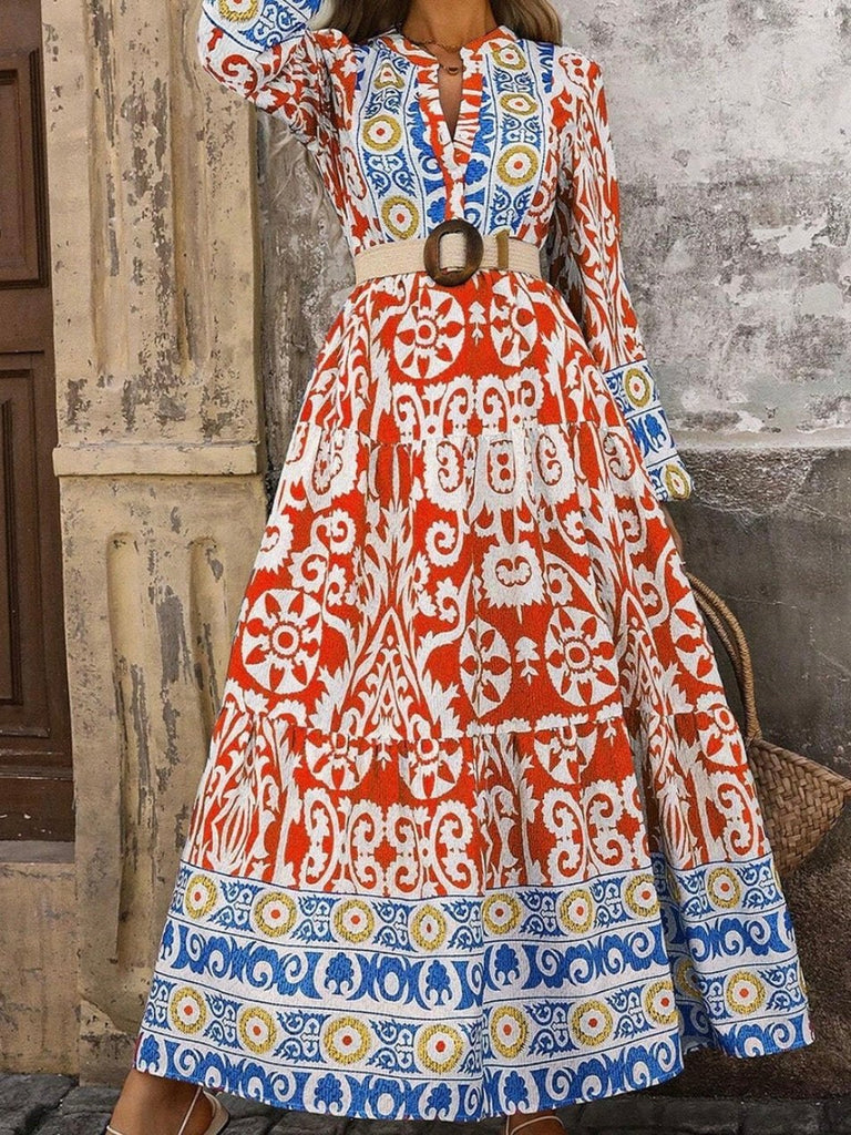  Long Boho Maxi Dress, in a beautiful Spanish print, with a Unique Geometric Pattern, accented by vibrant orangey-red and blue motifs.