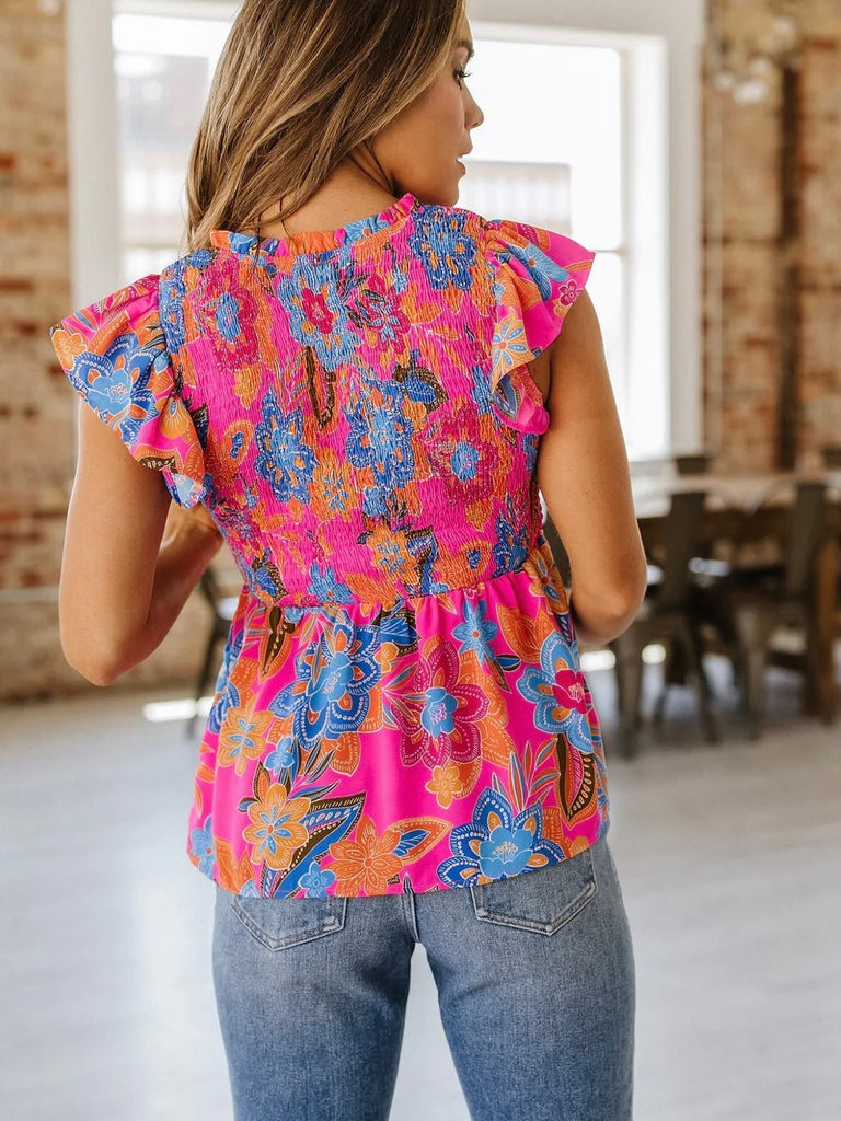 Lightweight frill peplum top with bold print