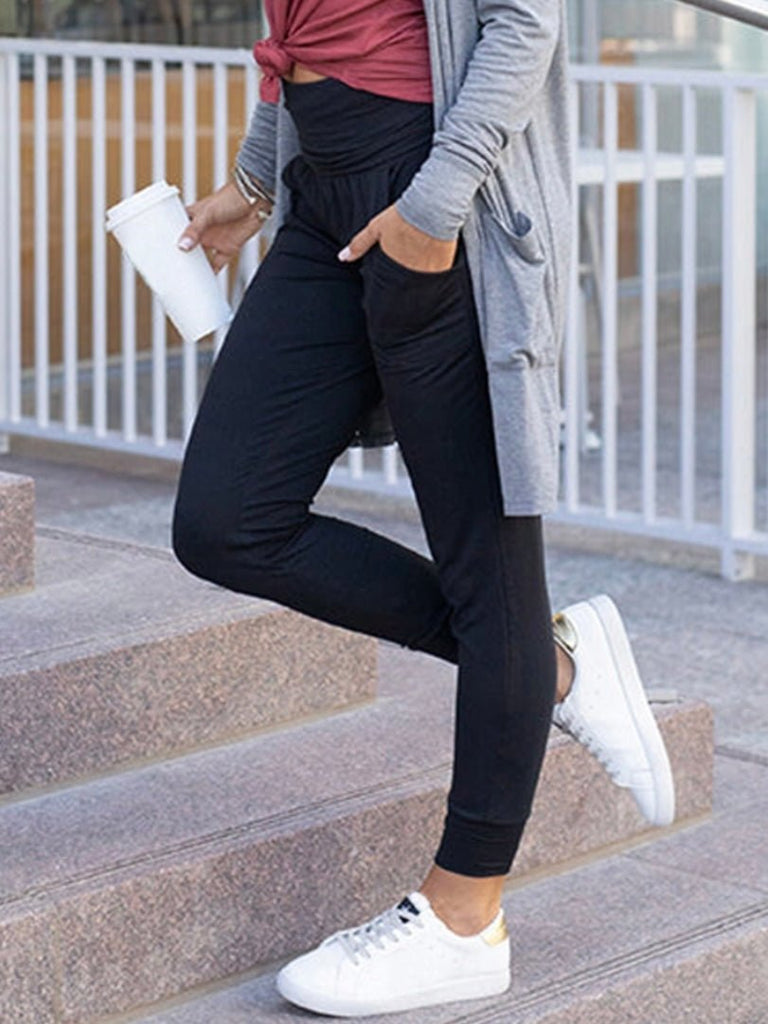 Side view of the black relaxed fit joggers with pockets