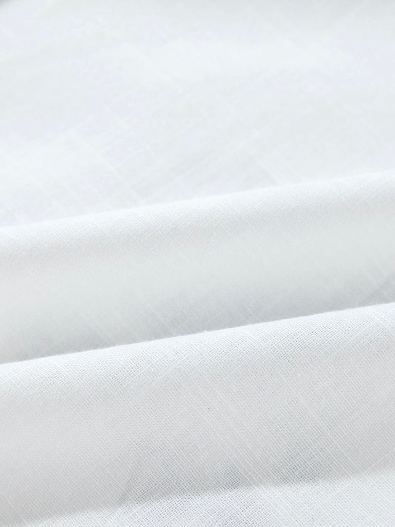 White and Black Floral Embroidery Top, Featuring a Frilled Collar and  Shirred Sleeves with Button Front.
