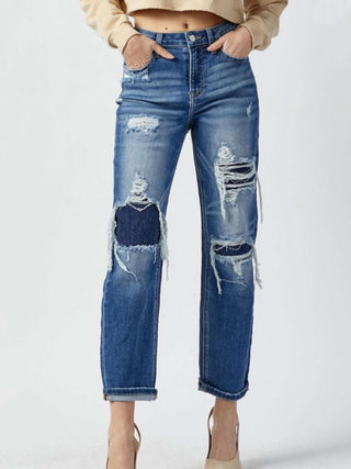 Cropped Length Distressed Patch Jeans with a Light Whisking throughout the Jean.