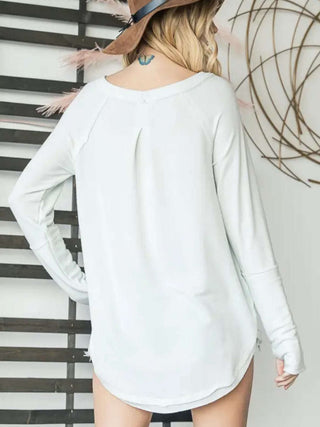 White Tunic length Crewneck Top has round raw hem with thumb holes and is made from polyester and has a nice longer fit.