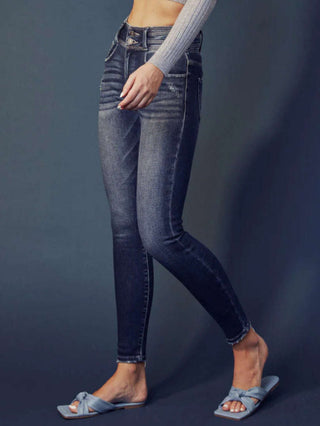 Super Skinny Fit, High Rise Jeans with heavy whiskering, and a double waistband, featuring classic five-pocket design, double-button front, and zip-fly closure.