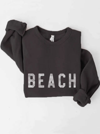 Black Beach Sweatshirt featuring ribbed cuffs and waistband, and a  classic crew neck and butter-soft fabric.