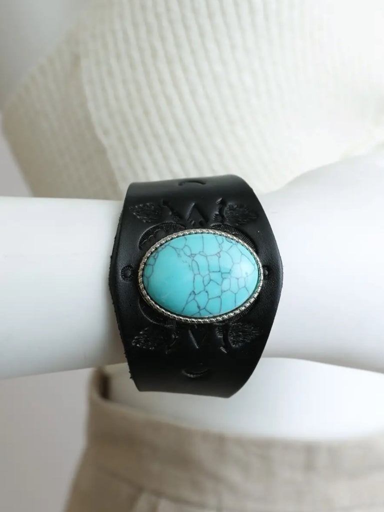  100% Leather Turquoise Inspired Stone and Celestial design tooled in snap closure cuff. 