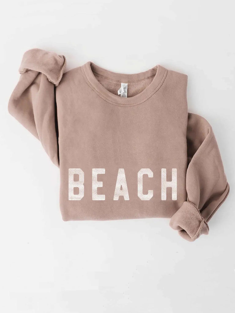 Tan Beach Sweatshirt featuring ribbed cuffs and waistband, and a classic crew neck and butter-soft fabric.
