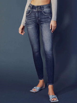  Super Skinny Fit, High Rise Jeans with  heavy whiskering, and a double waistband, featuring classic five-pocket design, double-button front, and zip-fly closure.