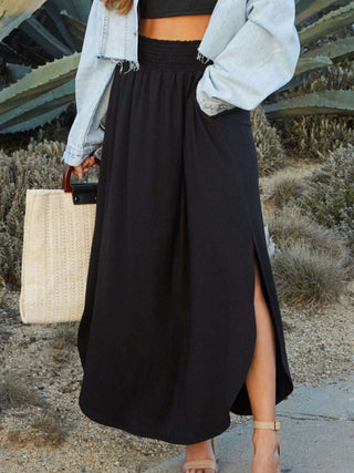 Black Maxi- Skirt smocking waist band  side slit and side pockets with  rounded hem-line.