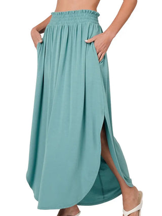 Teal  Maxi- Skirt smocking waist band side slit and side pockets with rounded hem-line.